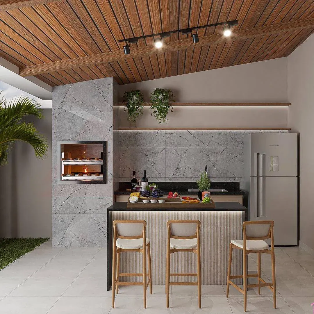 Áreas gourmet e churrasqueiras em Jaraguá do Sul — Pedreiro JC Área gourmet com churrasqueira construída por pedreiro profissional em Jaraguá do Sul — projeto de espaço de lazer com revestimento de mármore e acabamento moderno executado pelo Pedreiro JC (João Carlos).
